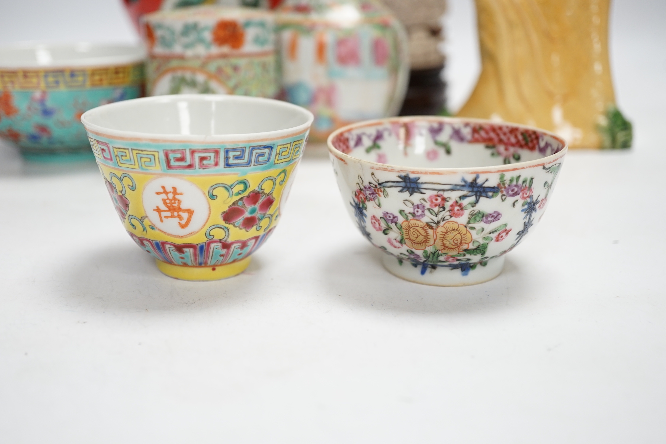 A group of Chinese ceramics 18th century and later, including a bottle vase, a water pipe vessel, box and cover, three bowls, a Tang style figure of a lady, a Yixing teapot, together with a resin figure of an emperor